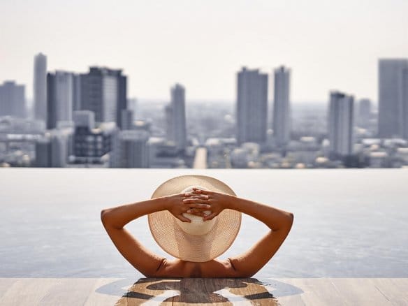 wowen in the pool looking bangkok skyline